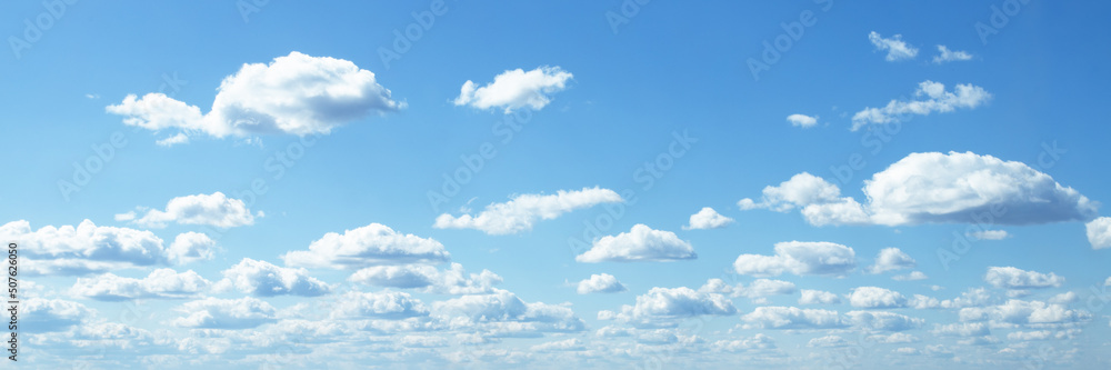 blue sky background banner, fluffy clouds on a summer day in sunlight blue sky background banner, fluffy clouds on a summer day in sunlight