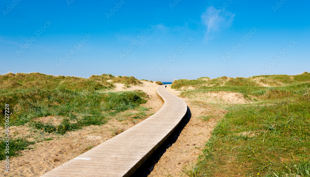 A wooden boardwalk leading to Solastranden beach from the car park and hotel resort, Stavanger, Norway, May 2018