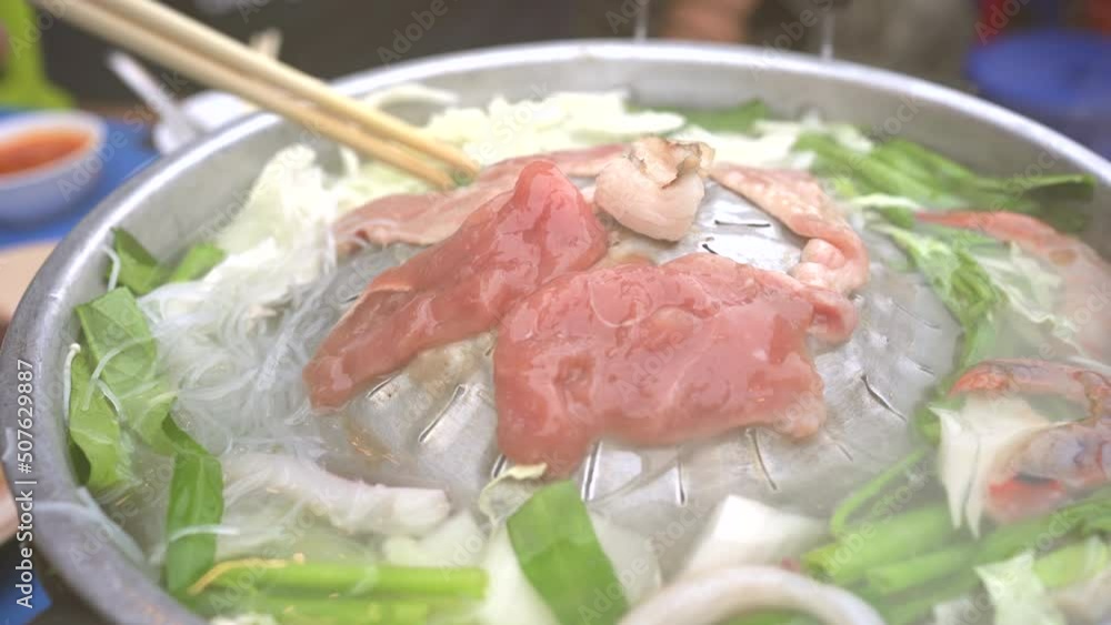 People enjoy eating Thai barbecue style called Moo Ka Ta. People enjoy eating Thai barbecue style called Moo Ka Ta.