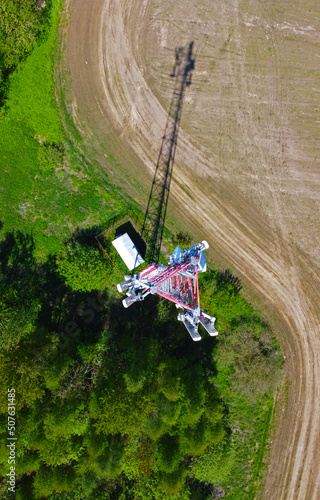 Aerial view of the tower of mobile communications  telecommunications and the 5g Internet. An iron head with locators and antennas. 25 May 2022  Minsk  Belarus