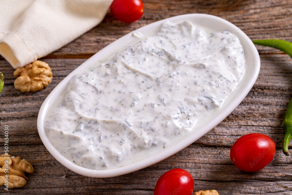 Haydari appetizer. Fresh snack prepared with yogurt and mint. Traditional Turkish cuisine delicacies. Close-up. Haydari appetizer. Fresh snack prepared with yogurt and mint. Traditional Turkish cuisine delicacies. Close-up.
