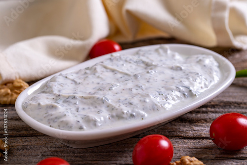 Haydari appetizer. Fresh snack prepared with yogurt and mint. Traditional Turkish cuisine delicacies. Close-up. photo