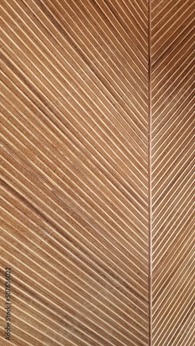 Foto herringbone pattern solid wooden batten wall background with natural color finis