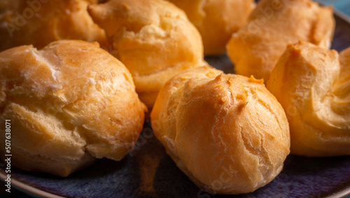 Profiteroles stuffed with cream, homemade bakery. close up © Andrei