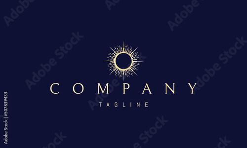 Vector golden logo on which an abstract image of a solar eclipse.