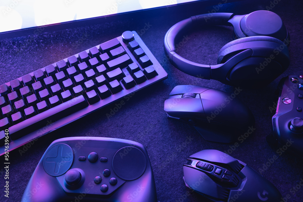 gamer work space concept, top view a gaming gear, mouse, keyboard, joystick, and headset gamer work space concept, top view a gaming gear, mouse, keyboard, joystick, and headset