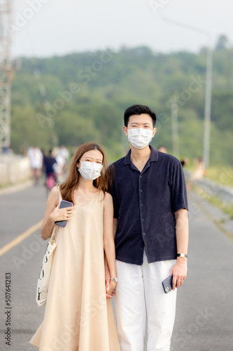 both male and female people walking and sitting on vacation with family Stay with beautiful nature, bright sky, green trees, good atmosphere. Khao Yai Thiang, Thailand Date 28-05-2022