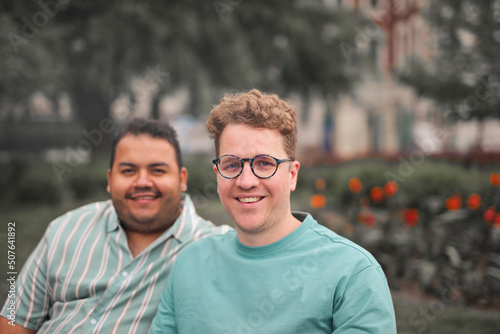 portrait of homosexual couple in a park