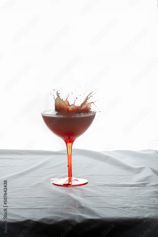 Something dropping in a wine glass Something dropping in a wine glass