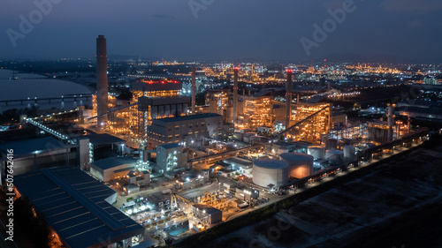 Aerial view coal power plant station at night  Power plant and coal storage heavy industrial coal powered electricity plant with pipes and smoke.