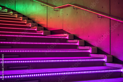 Rainbow lighted staircase at night