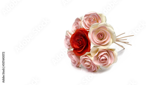 A bunch of bunches of roses laid out on a white background.