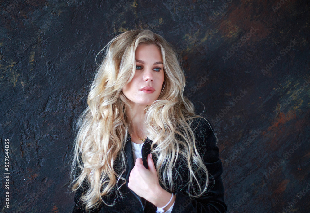 Serious and deeply thoughtful business woman in black suit, beautiful and emotional portrait in studio Serious and deeply thoughtful business woman in black suit, beautiful and emotional portrait in studio