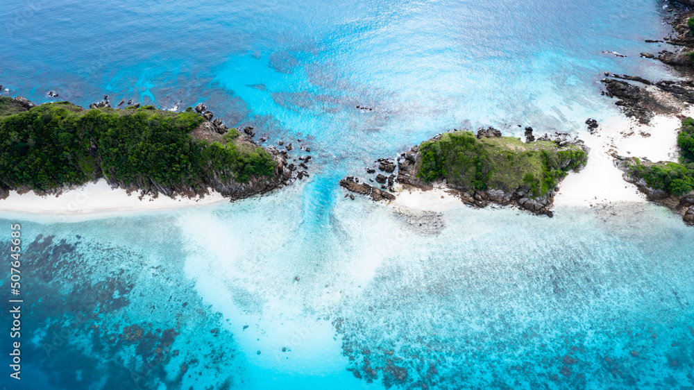 Aerial view beautiful beach forest ocean sea, Tropical island forest and emerald clear water, Tropical island with limestone rocks and turquoise clear water coral reef.