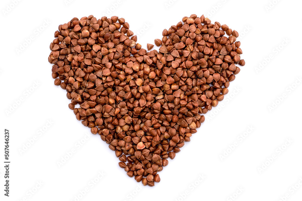 Heart made of buckwheat grains isolated on white background Heart made of buckwheat grains isolated on white background