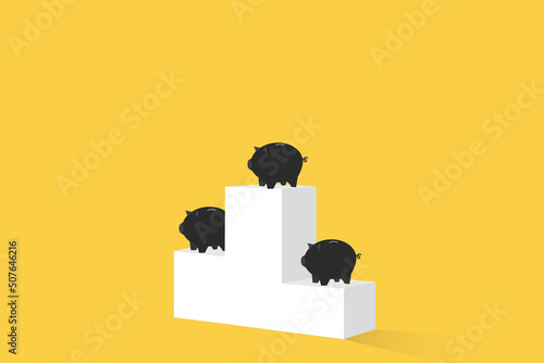 Piggy banks standing on the podium isolated on yellow background