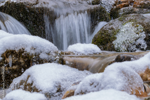 stream in the forest during winter (Tyrol, Austria)