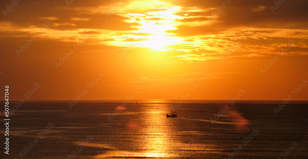 Ocean sunset with boats in sea. Mumbai, India