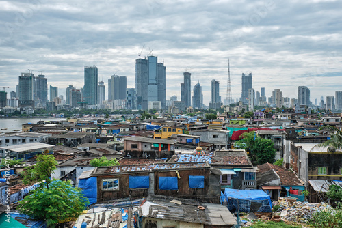 View of Mumbai skyline with skyscrapers over slums in Bandra suburb. Mumbai, Maharashtra, India photo