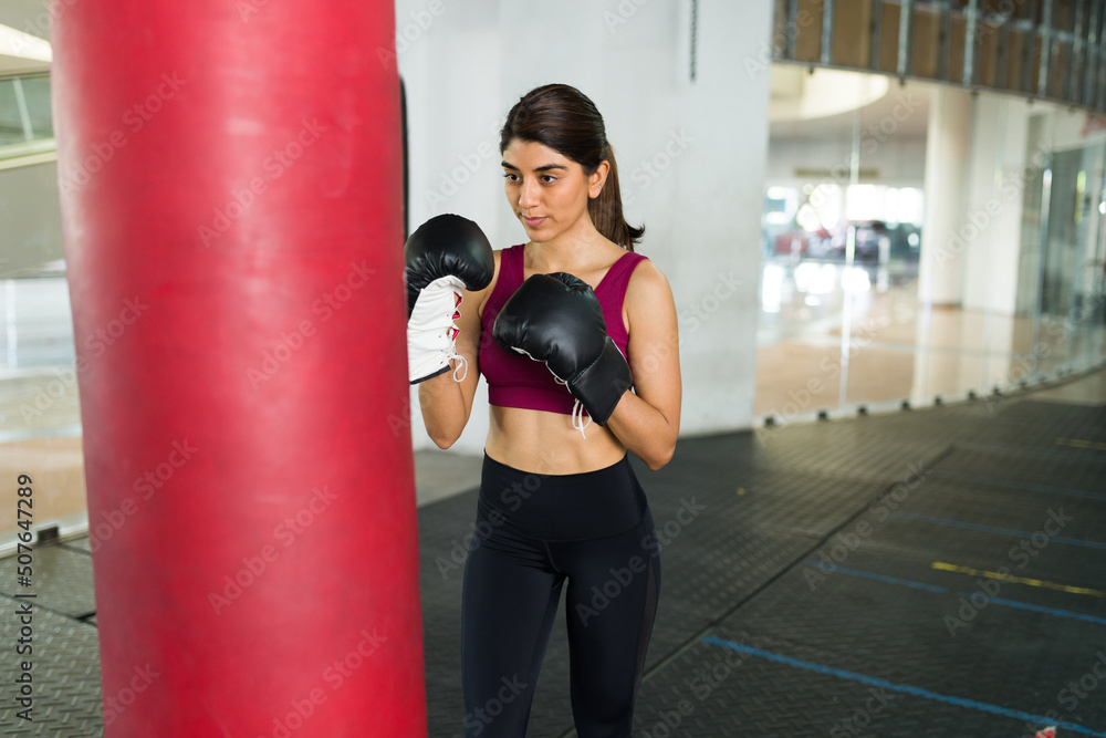 Attractive fit woman with boxing gloves