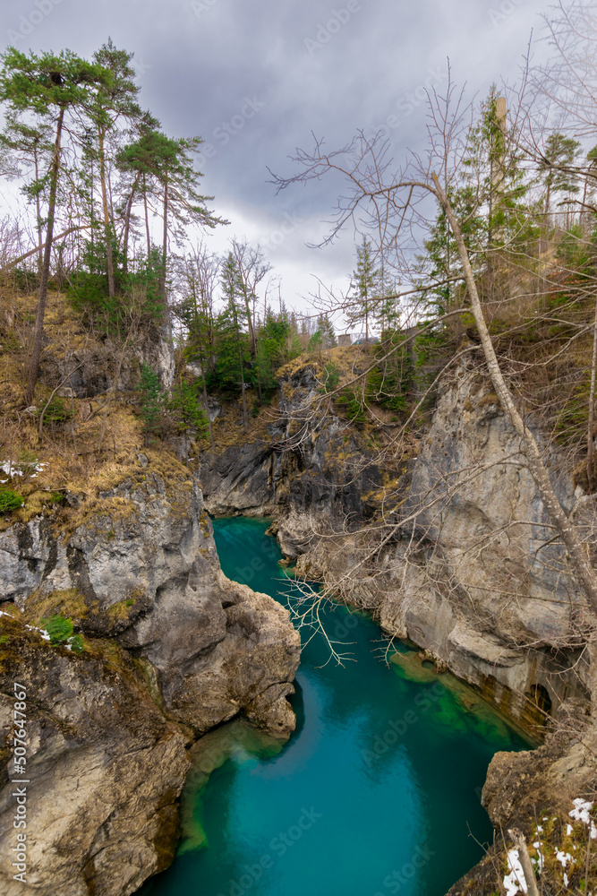 deep turquoise blue river at the Lechfall in Füssen, Austria