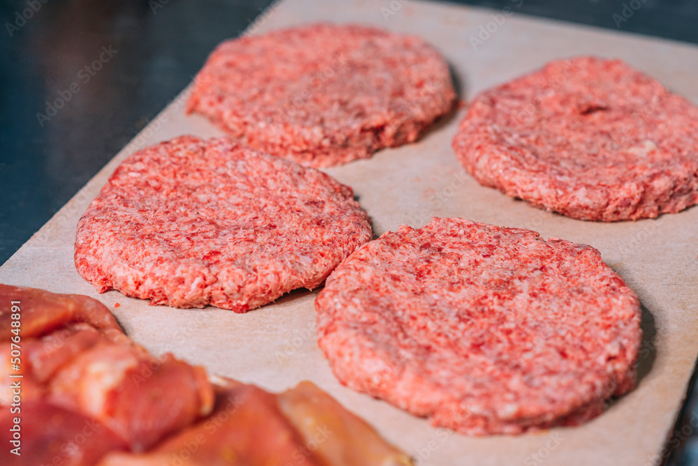 Raw meat cakes ready to be cooked and prepare delicious hamburgers. Raw meat cakes ready to be cooked and prepare delicious hamburgers.