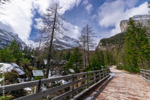 hiking path with a wooden bridge (Dolomites, Italy)
