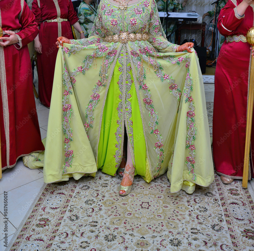 A Moroccan bride wears a green caftan. Wedding Traditions in Morocco