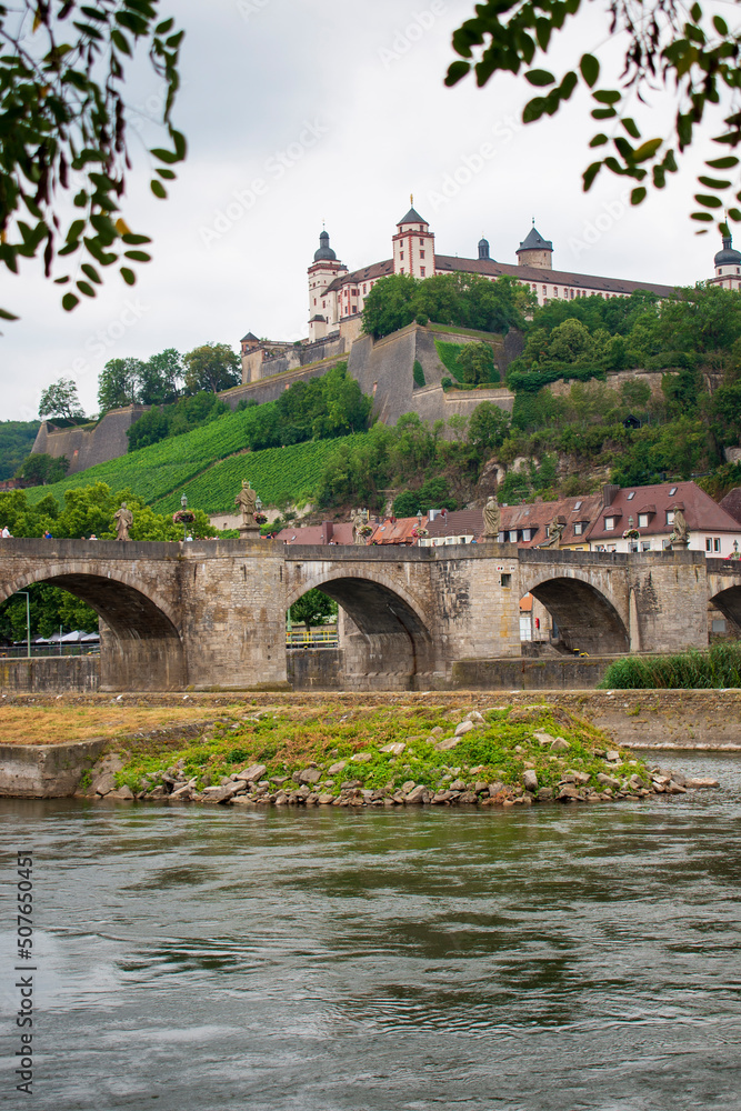 Historical built in Renaissance and Baroque styles Marienberg Fortress upon a vineyard hill above the Old Bridge and Main river seen from the other site of the river
