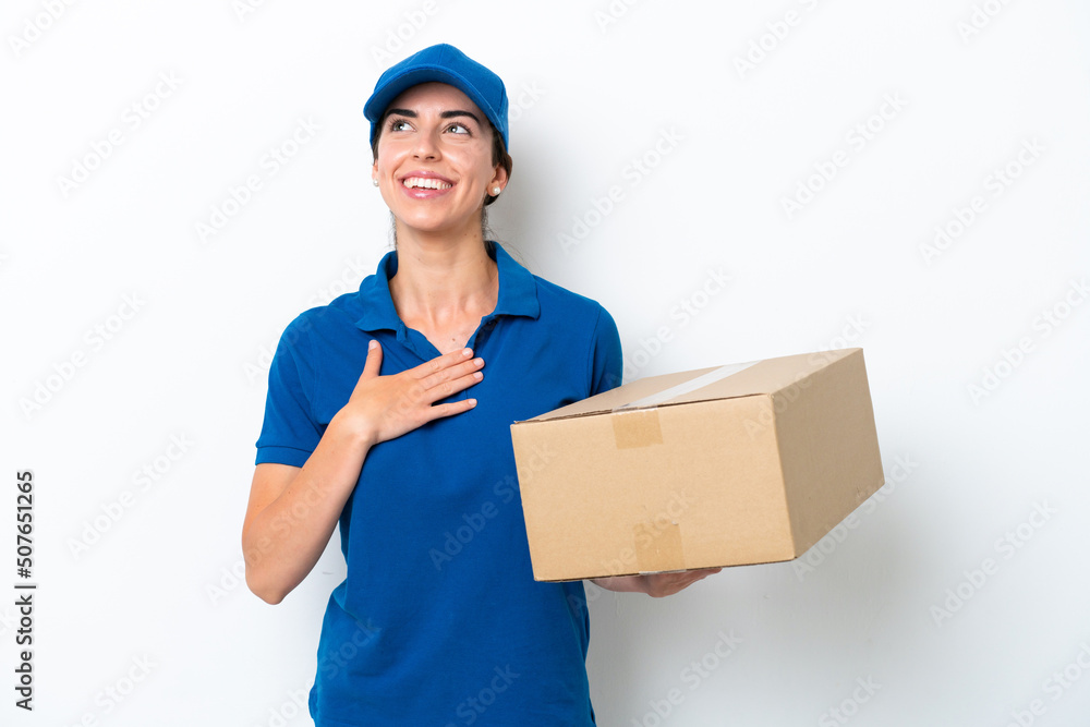 Delivery caucasian woman isolated on white background looking up while smiling Delivery caucasian woman isolated on white background looking up while smiling
