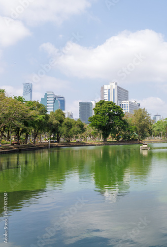 Cityscape and new office buildings view from public park Lumphini Park of Bangkok. 