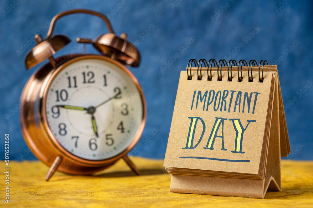 important day reminder note in a desktop calendar with an alarm clock important day reminder note in a desktop calendar with an alarm clock