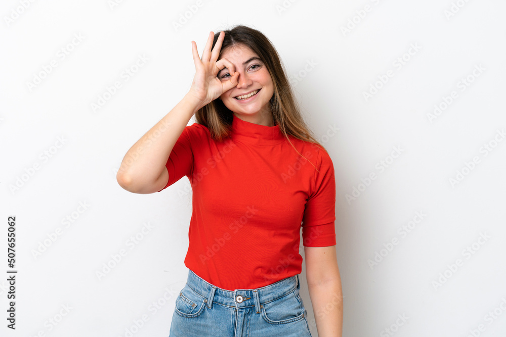 Young caucasian woman isolated on white background showing ok sign with fingers Young caucasian woman isolated on white background showing ok sign with fingers