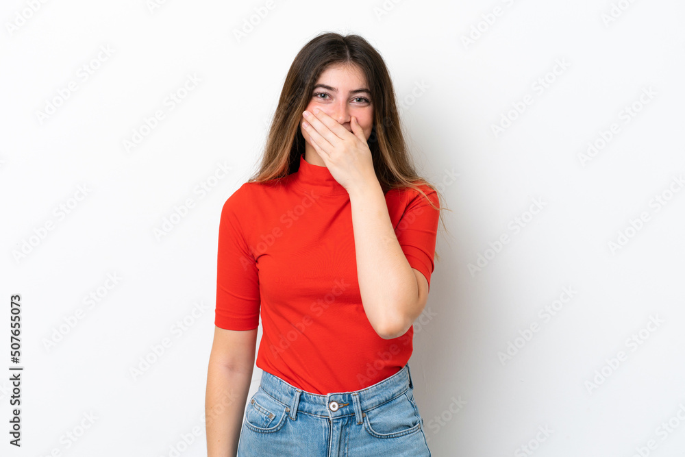 Young caucasian woman isolated on white background covering mouth with hand Young caucasian woman isolated on white background covering mouth with hand