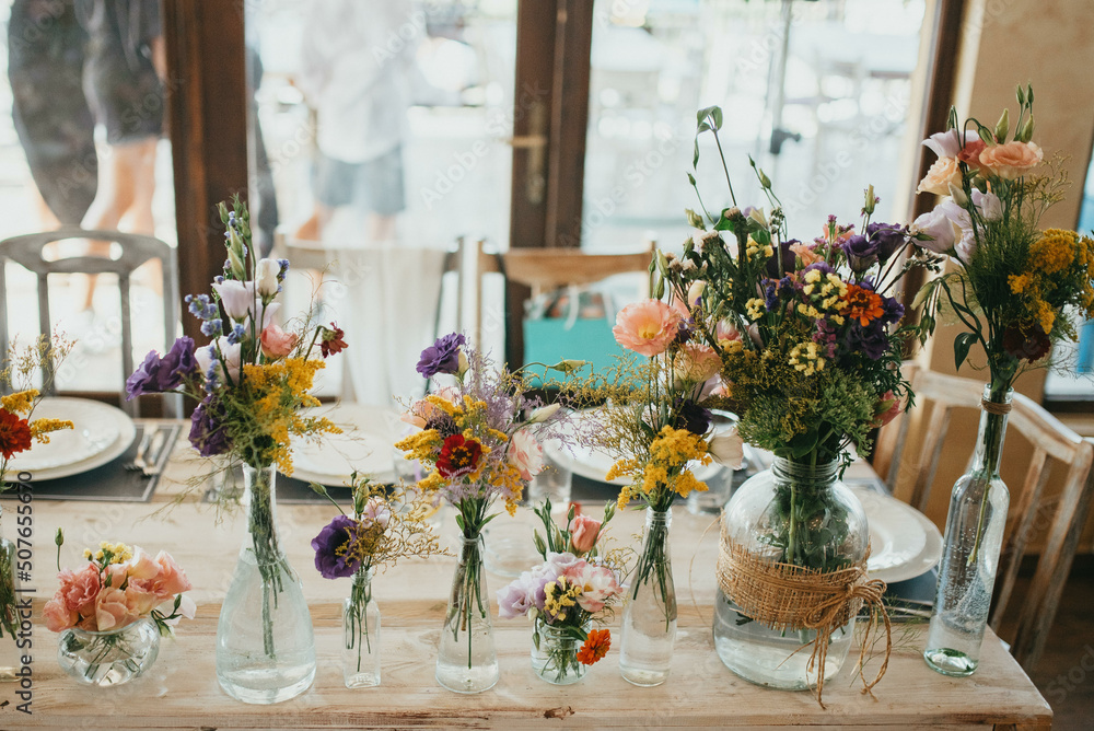 Rustic table decoration. Decoration with flowers. Rustic table decoration. Decoration with flowers.