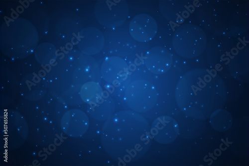 Blurred bokeh light on dark blue background