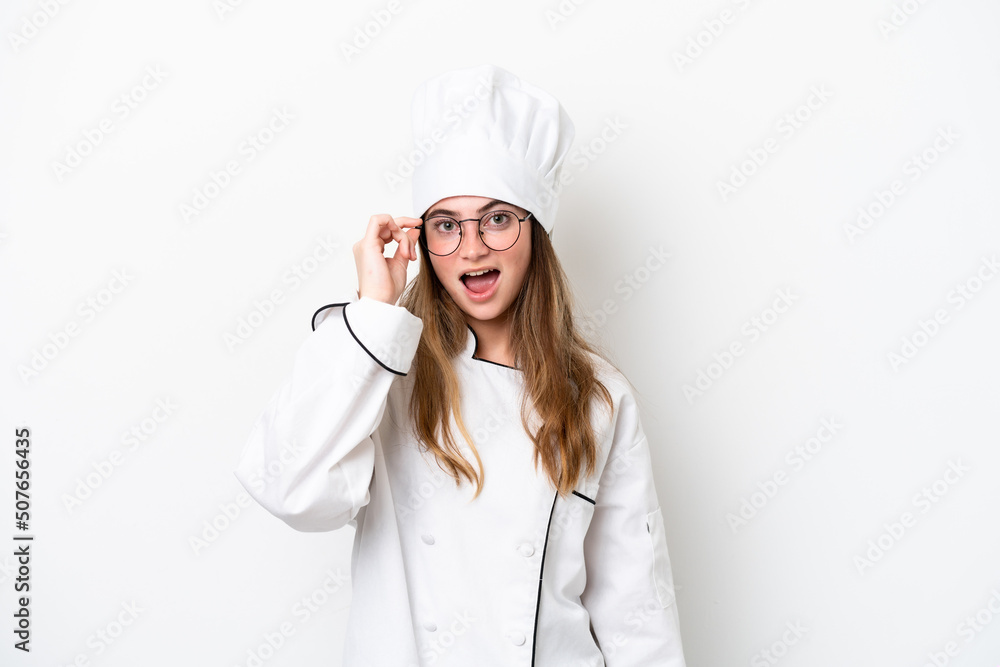 Young caucasian chef woman isolated on white background with glasses and surprised Young caucasian chef woman isolated on white background with glasses and surprised