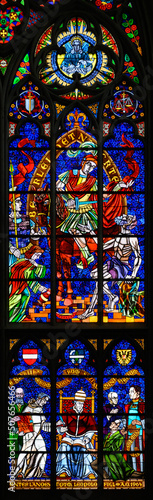 Stained-glass window depicting Catholic social reform, above Saint Martin of Tours, below Pope Leo XIII. Votivkirche – Votive Church, Vienna, Austria. 2020-07-29.	