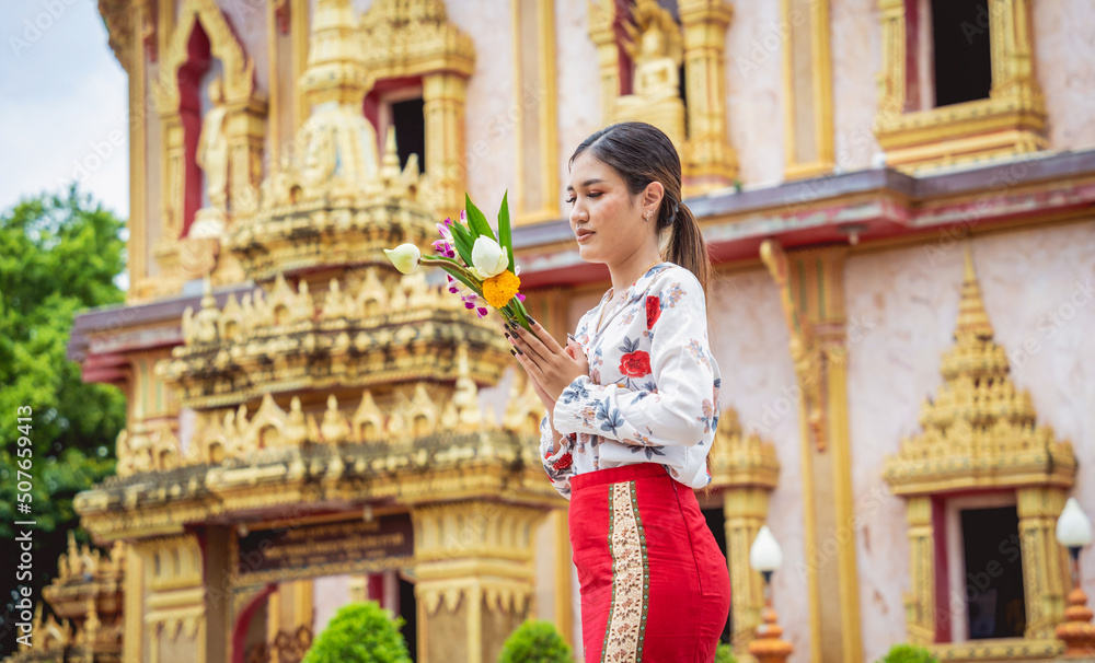 Beautiful Asian girl at big Buddhist temple dressed in traditional costume Beautiful Asian girl at big Buddhist temple dressed in traditional costume