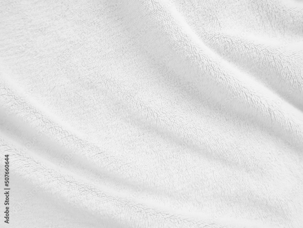 White clean wool texture background. light natural sheep wool fabric. white seamless cotton. texture of fluffy fur for designers. close-up fragment white wool carpet.
