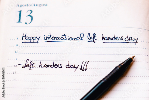 Happy lefties day! A notebook with the day August 13 with the words "Left handers day" written on it.
