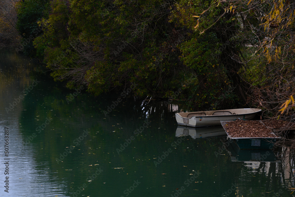 Naklejka premium little boats on the river in autumn