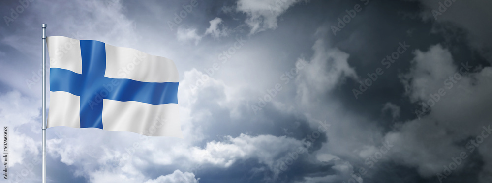 Obraz premium Finnish flag on a cloudy sky