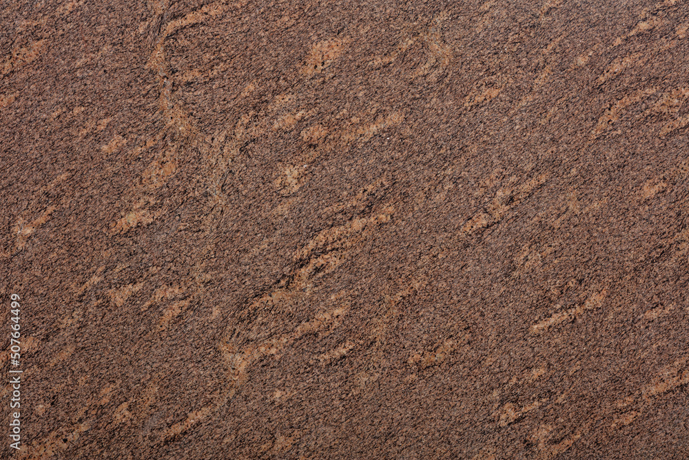 Giallo California Granite background, texture in brown tone as part of your design. Slab photo. Giallo California Granite background, texture in brown tone as part of your design. Slab photo.