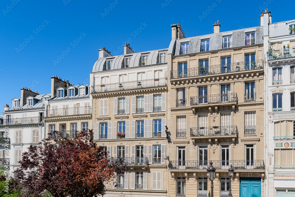 Paris, typical facade, beautiful building, with old zinc roofs
