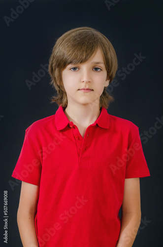 Portrait of serious kid looking straight ahead