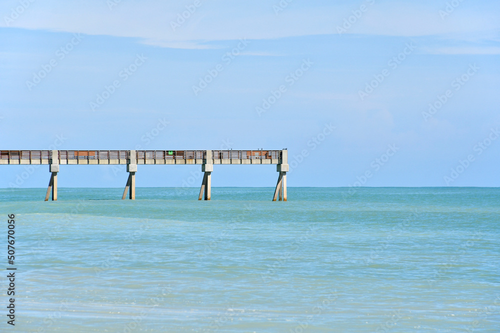 Vero Beach Pier on a beautiful, calm beach day in Vero Beach, Florida