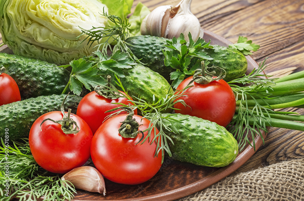 Fresh organic vegetables on a wooden table tomatoes, onions, cucumbers. Fresh organic vegetables on a wooden table tomatoes, onions, cucumbers.