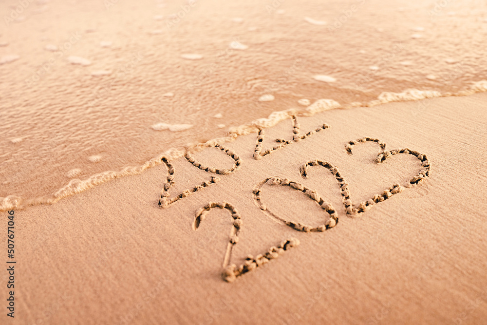 New Year 2025 replace 2022 on the sea beach concept. Stock Photo