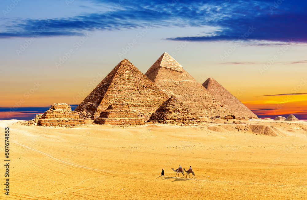 Beautiful sunset by the Pyramids of Giza in the sands of Egypt desert